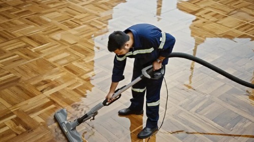 Commercial Water Damage 2 Water damage restoration crew extracting standing water from a flooded home
